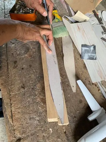 Carving the wood stage at the Wingcraft Models workshop, photo 1
